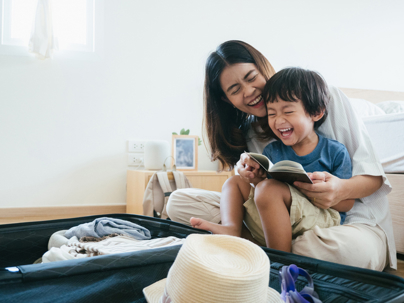 mother and son packing for a trip