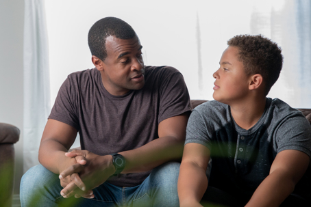 father and son in a serious discussion
